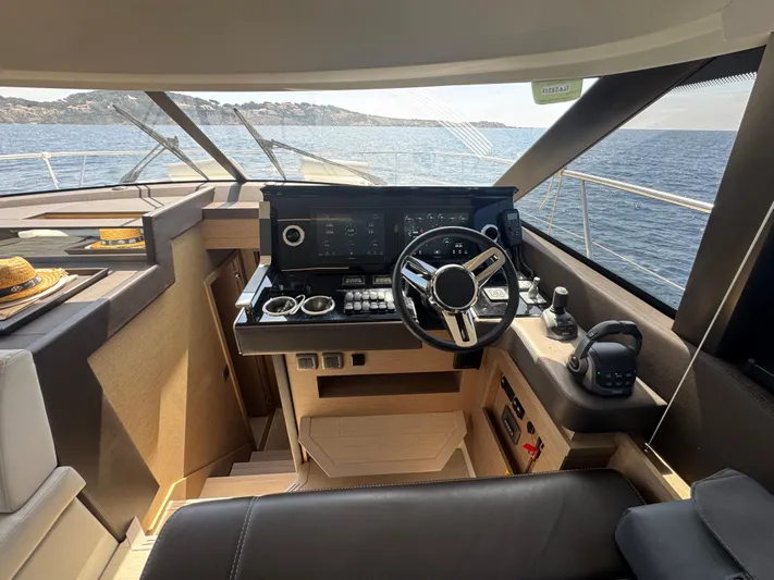  Yacht Photos Pics Modern helm of 2023 Prestige 460 yacht with ocean view.