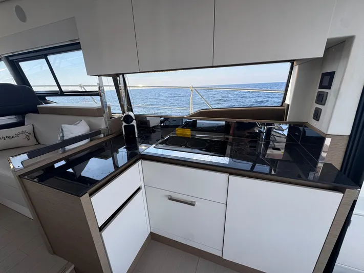  Yacht Photos Pics Modern kitchen interior on 2023 Prestige 460 yacht with ocean view.