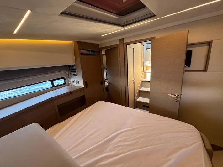  Yacht Photos Pics Luxurious interior of 2023 Prestige 460 yacht cabin with modern design and ambient lighting.
