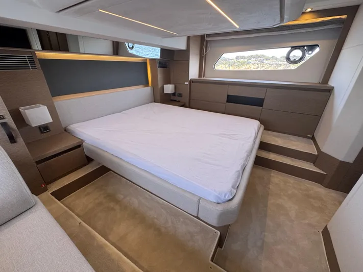 Yacht Photos Pics Luxurious bedroom interior of 2023 Prestige 460 yacht with modern design and elegant furnishings.