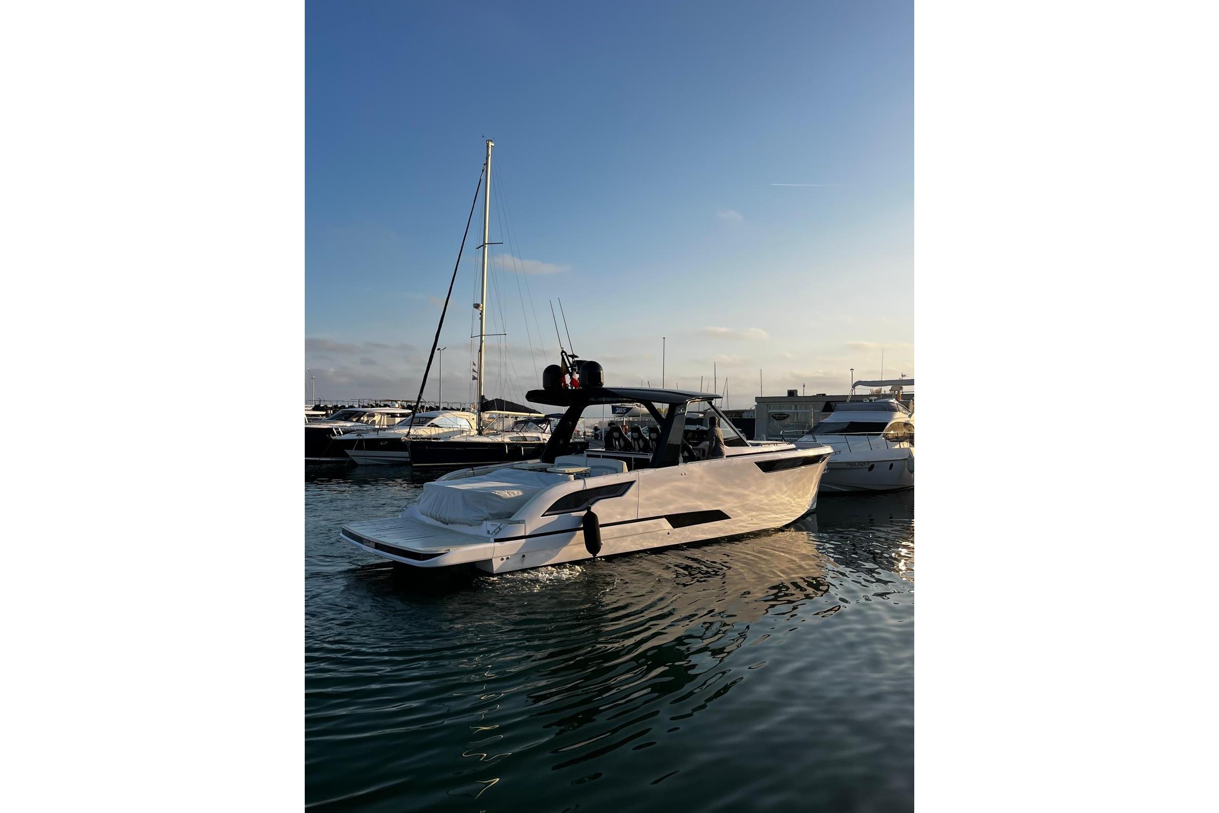 2025 Level Yachts 43 ST in marina at sunset, sleek design, calm waters.