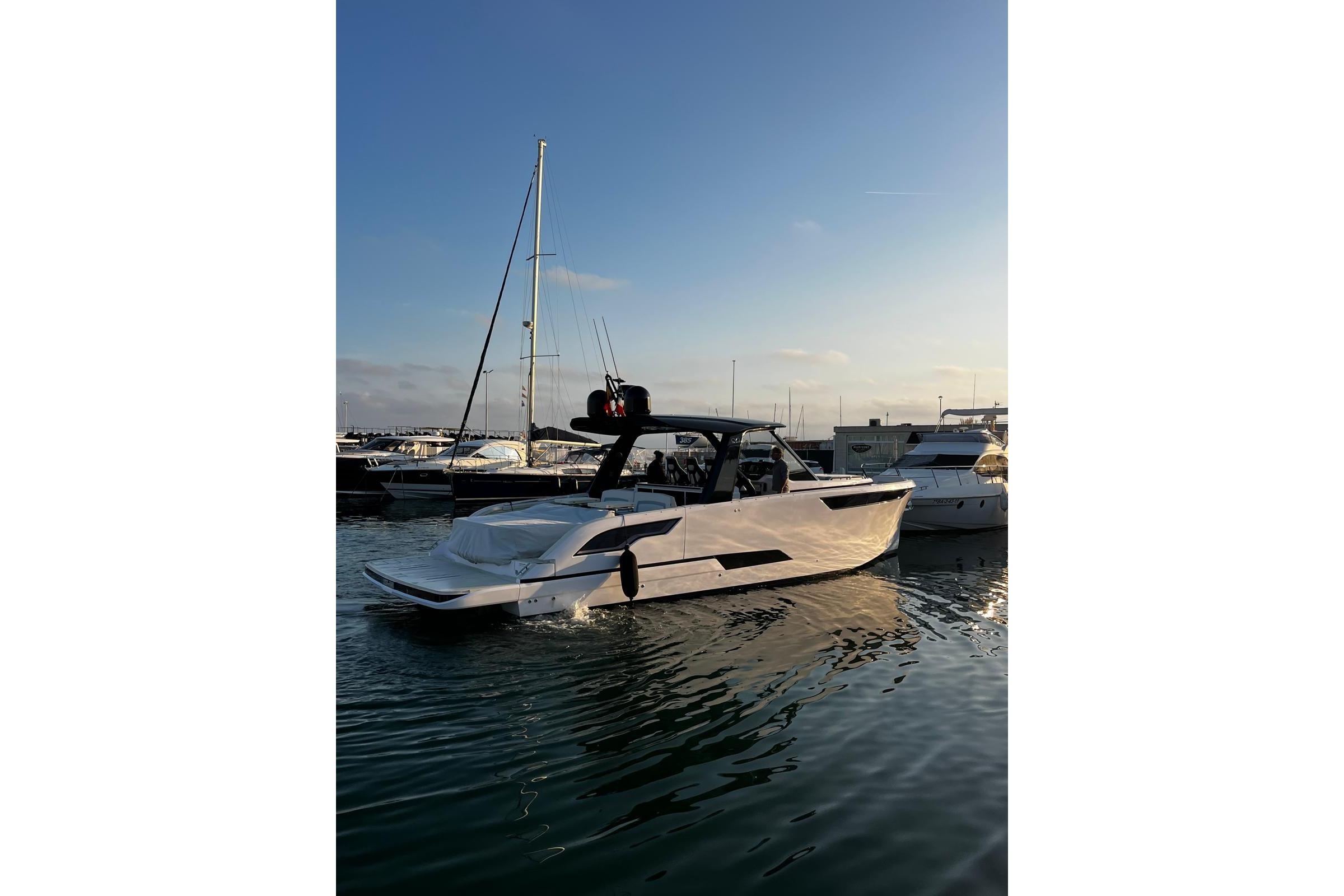 2025 Level Yachts 43 ST in marina at sunset, sleek design, calm waters.