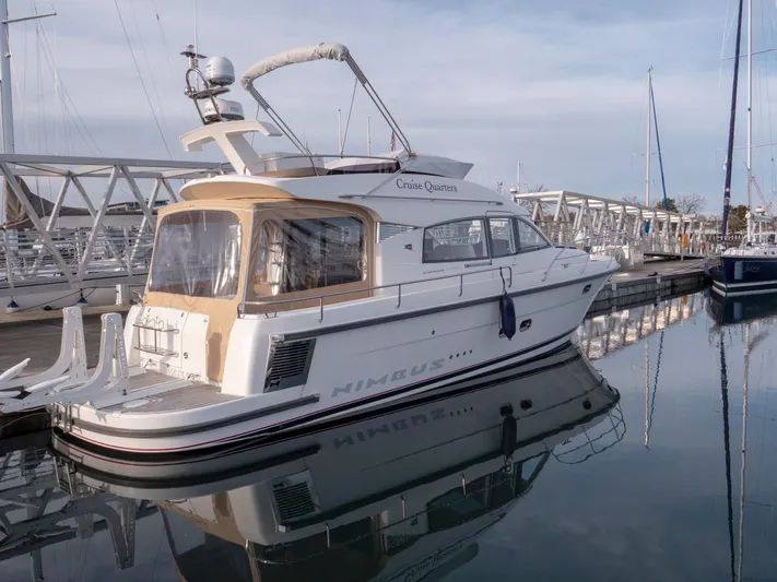 Seahawk Yacht Photos Pics Nimbus 405 Flybridge 2017 yacht docked in marina, reflecting on calm water.