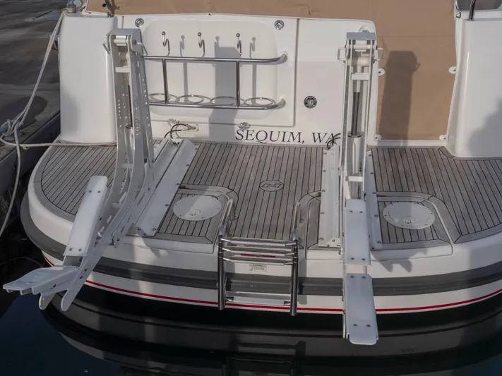 Seahawk Yacht Photos Pics Rear view of 2017 Nimbus 405 Flybridge boat with swim platform and ladder.