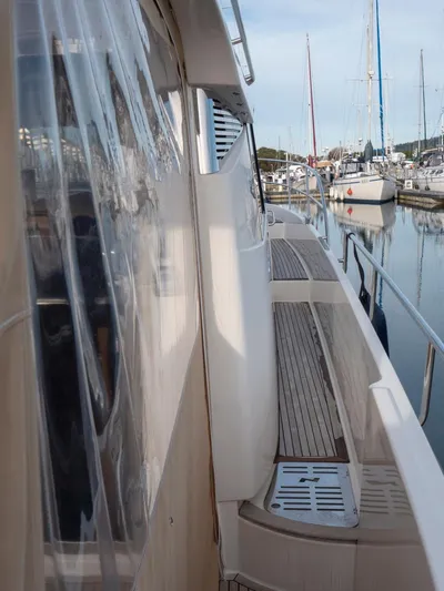 Seahawk Yacht Photos Pics Side view of 2017 Nimbus 405 Flybridge yacht docked at marina.