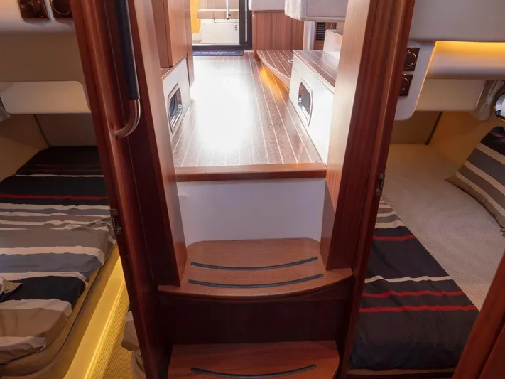 Seahawk Yacht Photos Pics Interior of 2017 Nimbus 405 Flybridge yacht, featuring cozy cabins and wooden finishes.