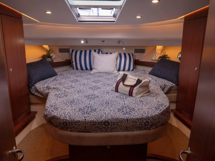 Seahawk Yacht Photos Pics Luxurious cabin interior of 2017 Nimbus 405 Flybridge with elegant bedding and decor.