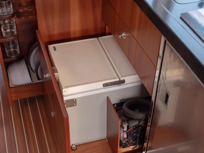 Seahawk Yacht Photos Pics Interior of 2017 Nimbus 405 Flybridge with open storage compartments and appliances.