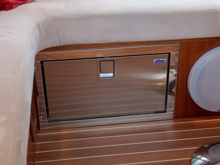 Seahawk Yacht Photos Pics Stainless steel storage compartment on Nimbus 405 Flybridge, 2017 model, with wooden flooring.