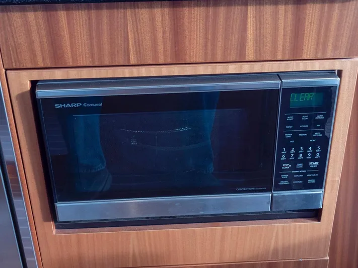 Seahawk Yacht Photos Pics Sharp Carousel microwave in Nimbus 405 Flybridge yacht, 2017 model, with wood paneling.