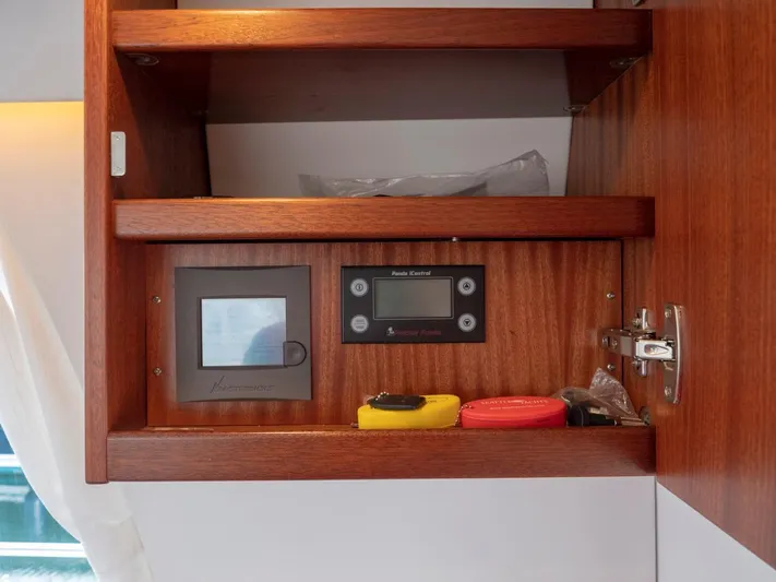 Seahawk Yacht Photos Pics Wooden cabinet with control panels and items, Nimbus 405 Flybridge 2017.
