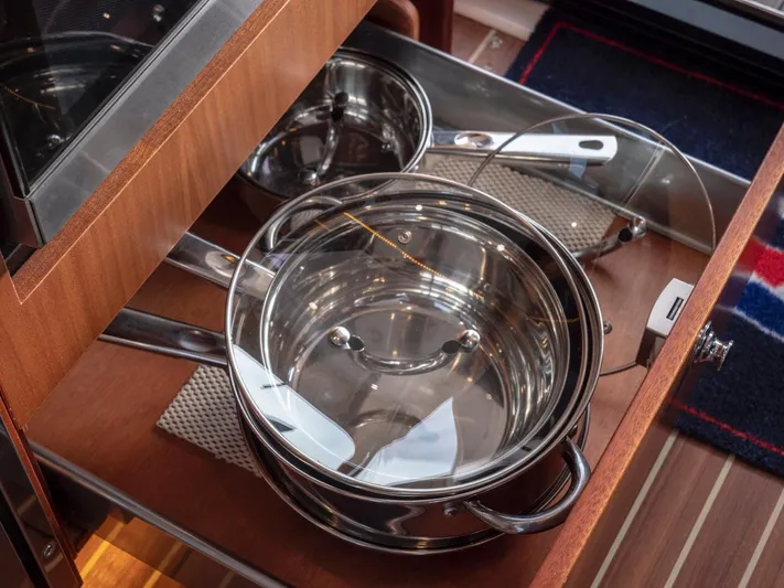 Seahawk Yacht Photos Pics Stainless steel pots in a wooden drawer on a 2017 Nimbus 405 Flybridge yacht.
