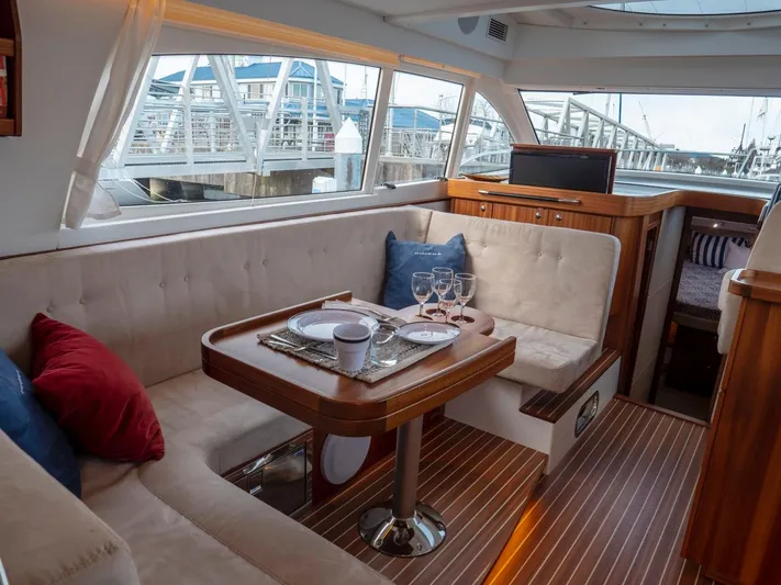Seahawk Yacht Photos Pics Luxurious interior of 2017 Nimbus 405 Flybridge yacht with elegant dining area.