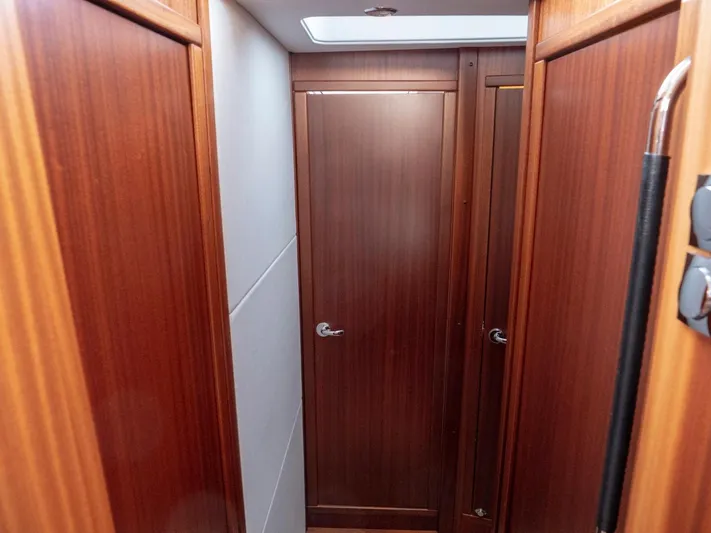 Seahawk Yacht Photos Pics Hallway with wooden doors inside a 2017 Nimbus 405 Flybridge yacht.