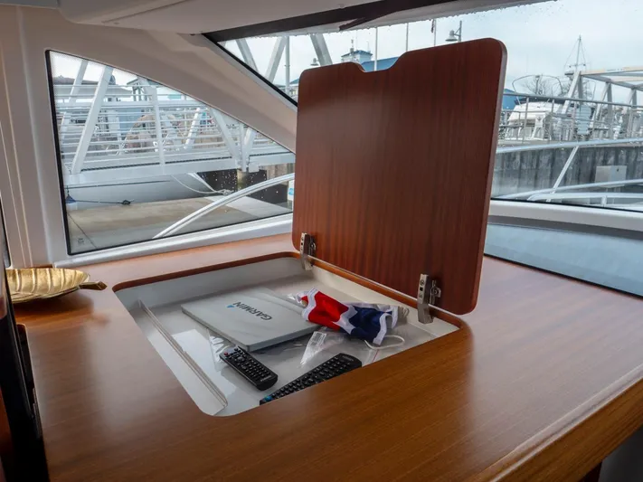 Seahawk Yacht Photos Pics Interior of 2017 Nimbus 405 Flybridge yacht with storage compartment open.