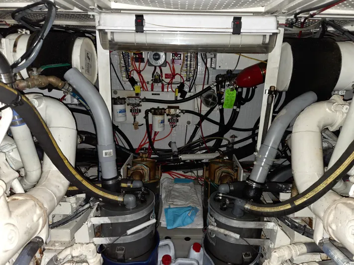 Pazzaz Yacht Photos Pics Engine room of 1985 Chris-Craft 500 Constellation Motor Yacht with complex machinery and wiring.