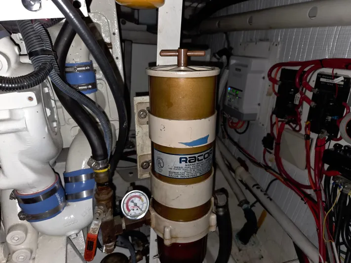 Pazzaz Yacht Photos Pics Engine room of 1985 Chris-Craft 500 Constellation Motor Yacht with Racor fuel filter system.