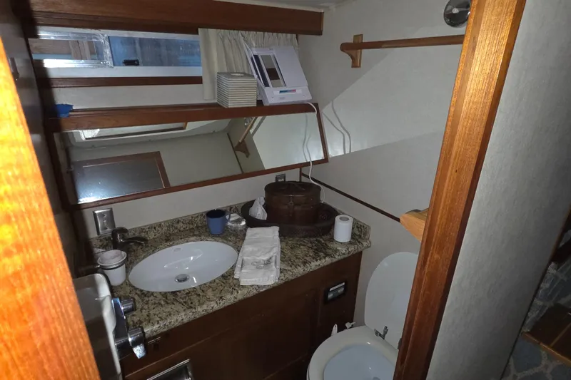 Pazzaz Yacht Photos Pics Bathroom interior of 1985 Chris-Craft 500 Constellation Motor Yacht with granite countertop.