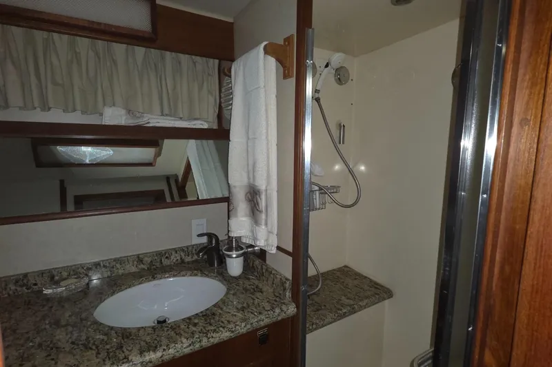 Pazzaz Yacht Photos Pics Bathroom interior of 1985 Chris-Craft 500 Constellation Motor Yacht with granite countertop.