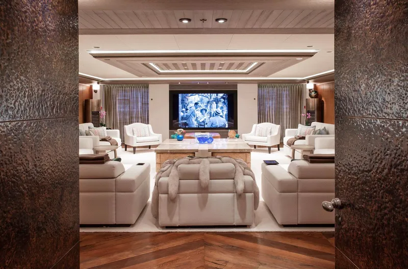 Luna Yacht Photos Pics Luxurious yacht interior with plush seating, large TV, and elegant decor, Custom Lloyd Werft 2010 model.