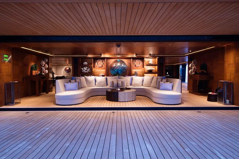 Luna Yacht Photos Pics Luxurious yacht interior with elegant seating, wooden decor, and ambient lighting, Custom Lloyd Werft 2010.
