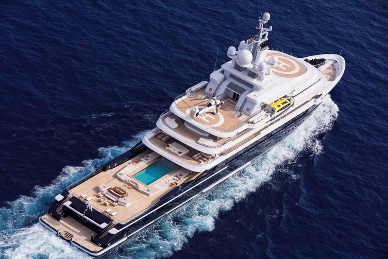 Luna Yacht Photos Pics Luxurious 2010 Custom Lloyd Werft yacht with helipads and pool cruising on open sea.