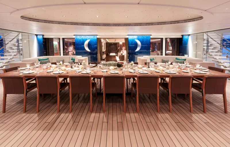 Luna Yacht Photos Pics Luxurious yacht dining area with elegant table setting, Custom Lloyd Werft 2010 model.