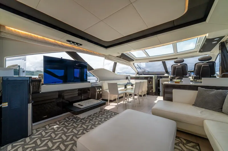 Carpe Diem Yacht Photos Pics Luxurious interior of 2017 Azimut 77S yacht with modern furnishings and panoramic windows.