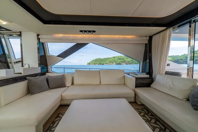 Carpe Diem Yacht Photos Pics Luxurious interior of 2017 Azimut 77S yacht with ocean view through large windows.
