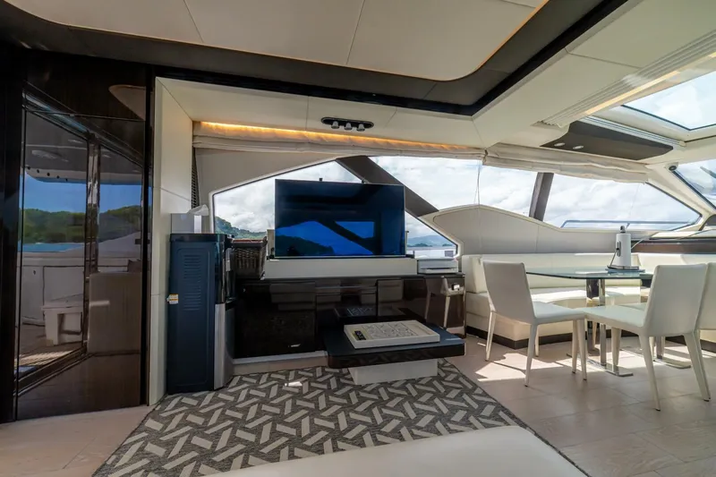 Carpe Diem Yacht Photos Pics Luxurious interior of 2017 Azimut 77S yacht with modern furnishings and panoramic windows.