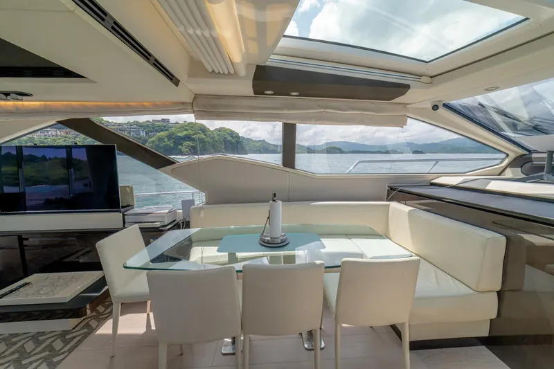 Carpe Diem Yacht Photos Pics Luxurious interior of 2017 Azimut 77S yacht with glass table and scenic views.