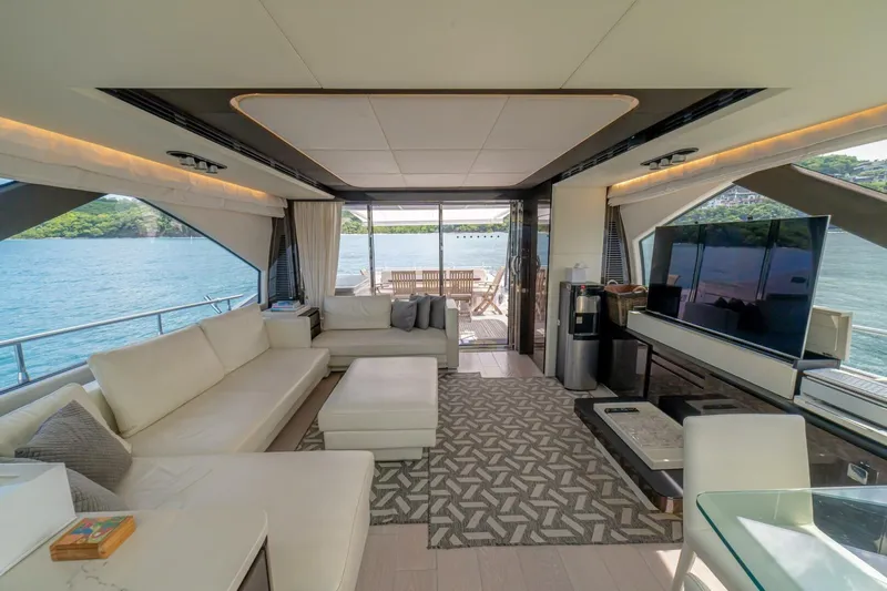 Carpe Diem Yacht Photos Pics Luxurious interior of 2017 Azimut 77S yacht with elegant seating and scenic water views.