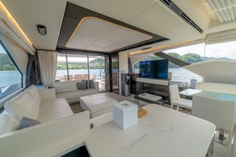 Carpe Diem Yacht Photos Pics Luxurious interior of 2017 Azimut 77S yacht with modern furnishings and scenic views.