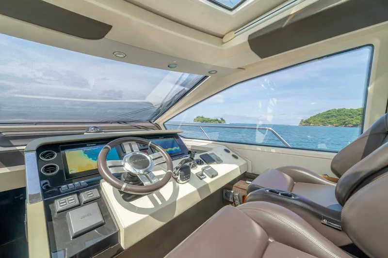 Carpe Diem Yacht Photos Pics Luxurious interior of 2017 Azimut 77S yacht with ocean view and modern helm.