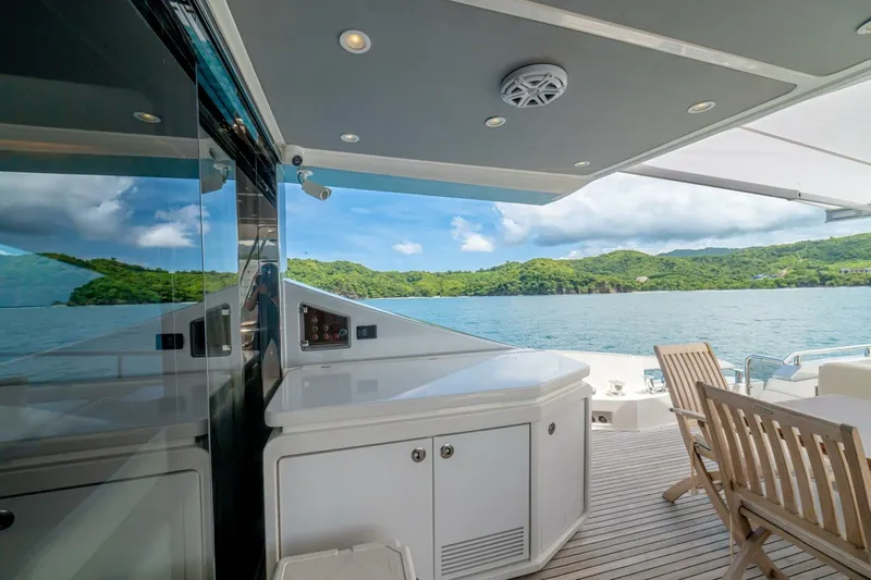 Carpe Diem Yacht Photos Pics Luxurious Azimut 77S yacht deck with ocean view, featuring elegant seating and modern amenities.