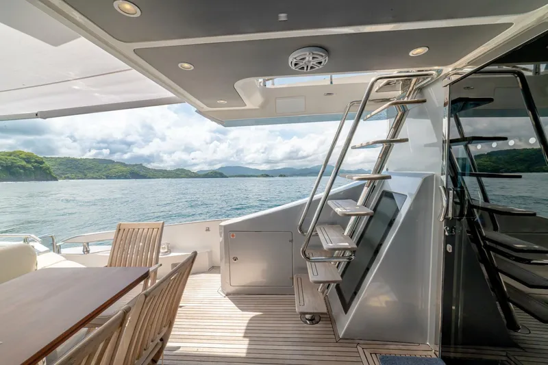 Carpe Diem Yacht Photos Pics Luxurious 2017 Azimut 77S yacht deck with seating, ocean view, and modern staircase.