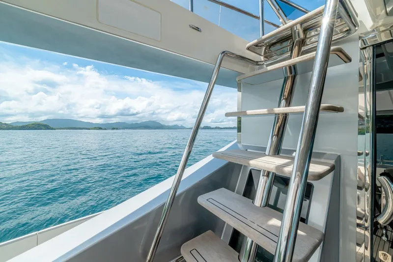 Carpe Diem Yacht Photos Pics Stainless steel staircase on 2017 Azimut 77S yacht with ocean view.