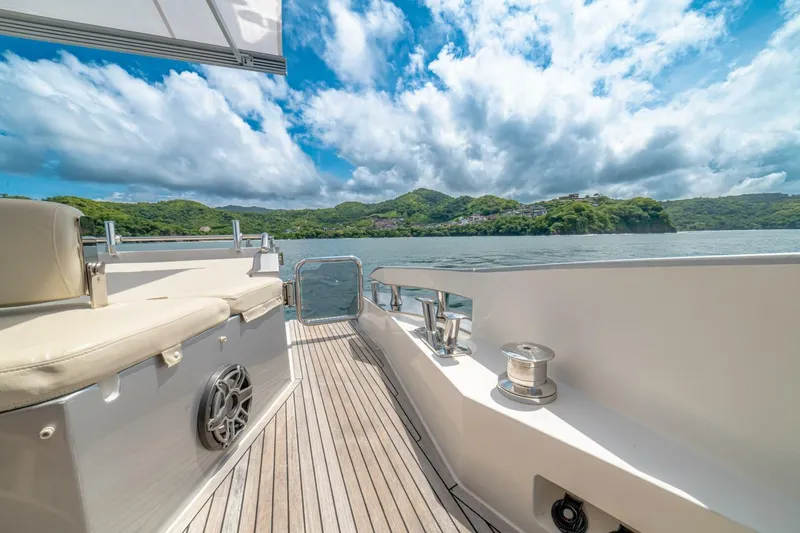 Carpe Diem Yacht Photos Pics Azimut 77S 2017 yacht deck with scenic ocean and lush green hills.