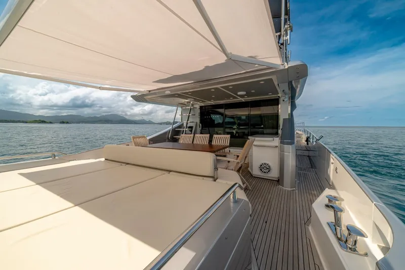 Carpe Diem Yacht Photos Pics Luxurious 2017 Azimut 77S yacht deck with seating, ocean view, and sunshade.