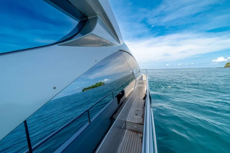 Carpe Diem Yacht Photos Pics Azimut 77S yacht cruising on open sea, 2017 model, sleek design, clear blue sky.