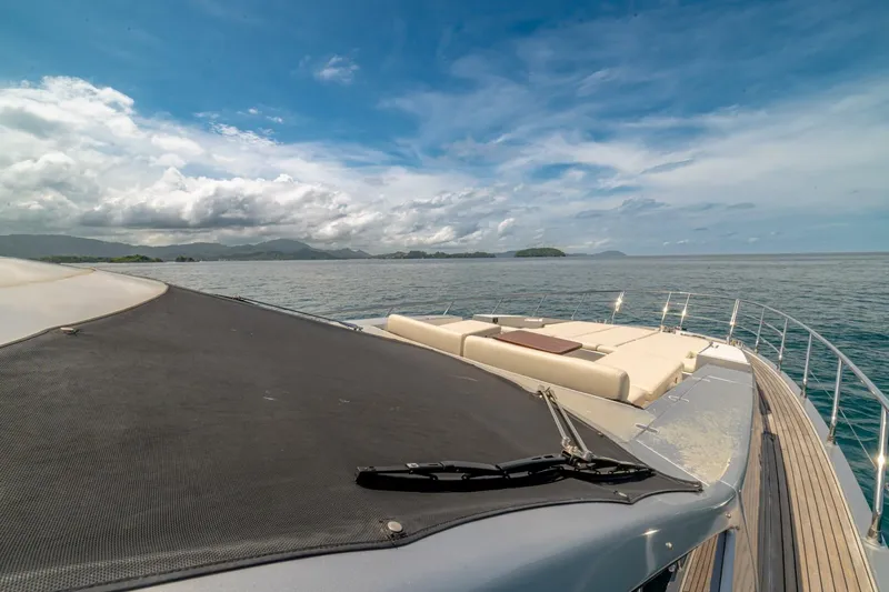 Carpe Diem Yacht Photos Pics Luxurious 2017 Azimut 77S yacht cruising on serene waters under a clear blue sky.