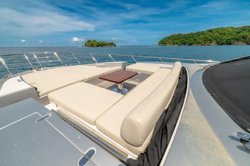 Carpe Diem Yacht Photos Pics Luxurious 2017 Azimut 77S yacht deck with seating, ocean view, and distant islands.