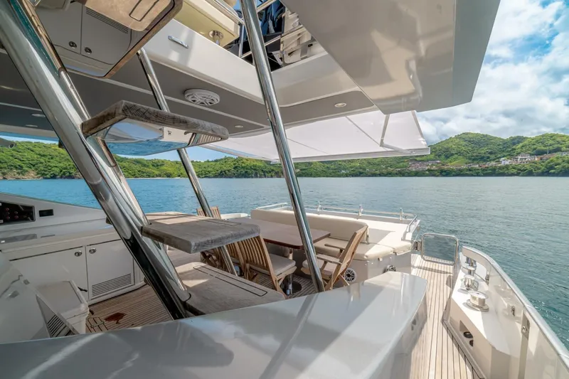 Carpe Diem Yacht Photos Pics Luxurious 2017 Azimut 77S yacht deck with scenic ocean view and elegant seating area.