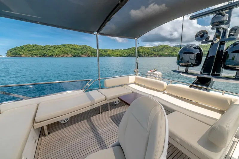 Carpe Diem Yacht Photos Pics Luxurious 2017 Azimut 77S yacht deck with ocean view and island backdrop.