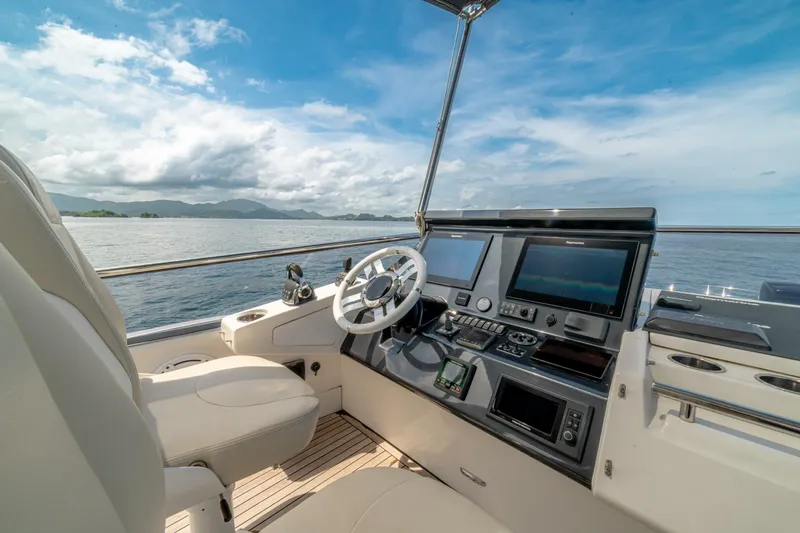 Carpe Diem Yacht Photos Pics Cockpit of 2017 Azimut 77S yacht with modern navigation equipment and ocean view.
