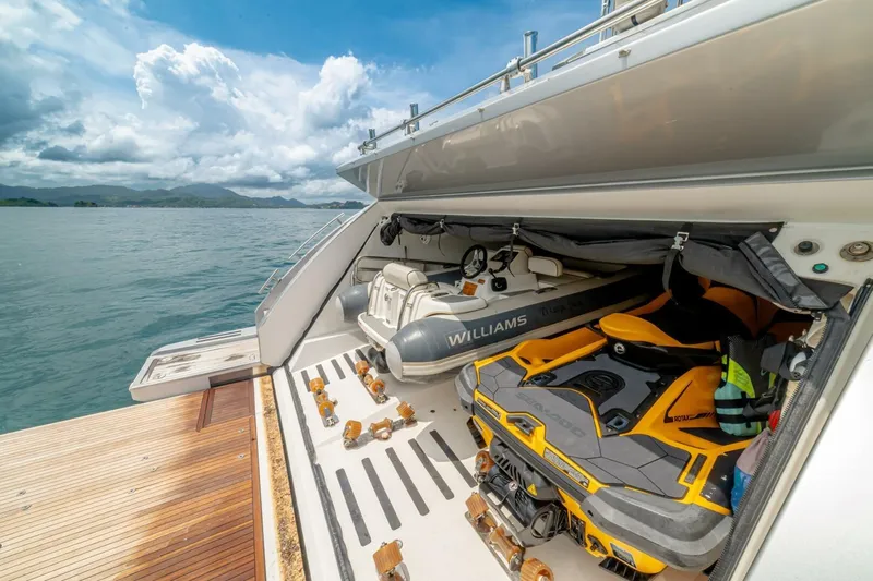 Carpe Diem Yacht Photos Pics Azimut 77S yacht with jet ski and tender in storage, 2017 model, ocean backdrop.