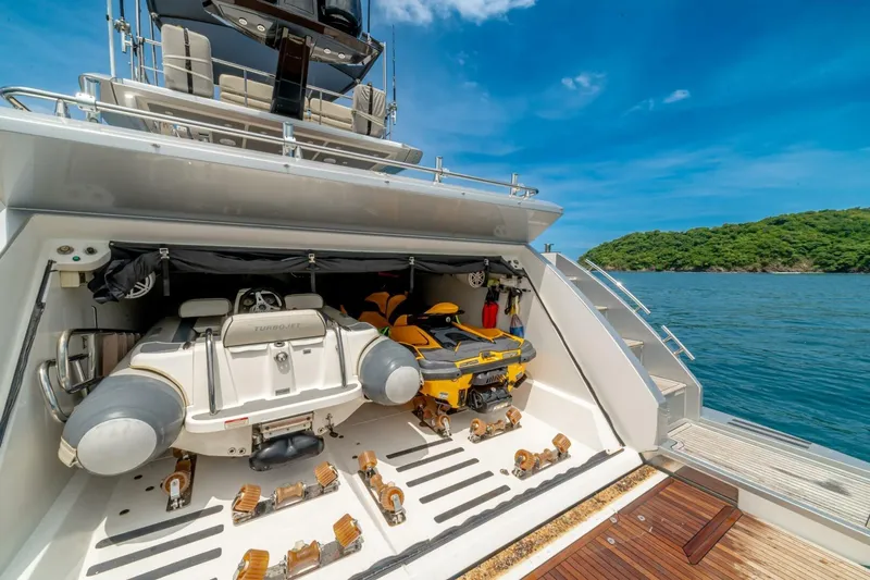 Carpe Diem Yacht Photos Pics 2017 Azimut 77S yacht with open garage, featuring a jet ski and tender.