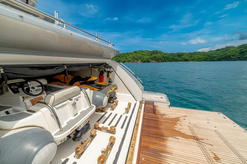 Carpe Diem Yacht Photos Pics Azimut 77S 2017 yacht with open garage, jet ski, and scenic ocean view.