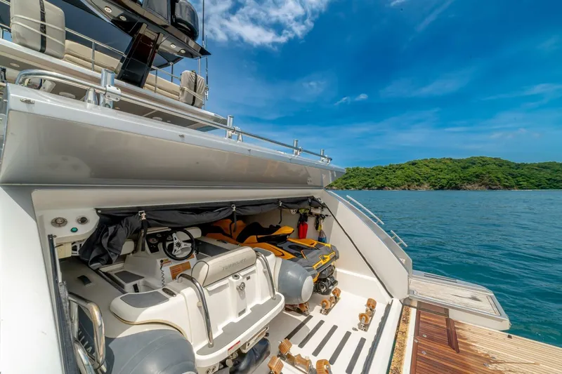 Carpe Diem Yacht Photos Pics 2017 Azimut 77S yacht with open garage, jet ski, and scenic ocean view.