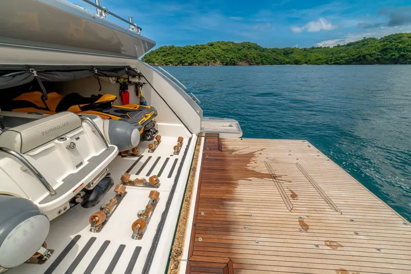 Carpe Diem Yacht Photos Pics Azimut 77S 2017 yacht with open garage, jet ski, and scenic ocean view.